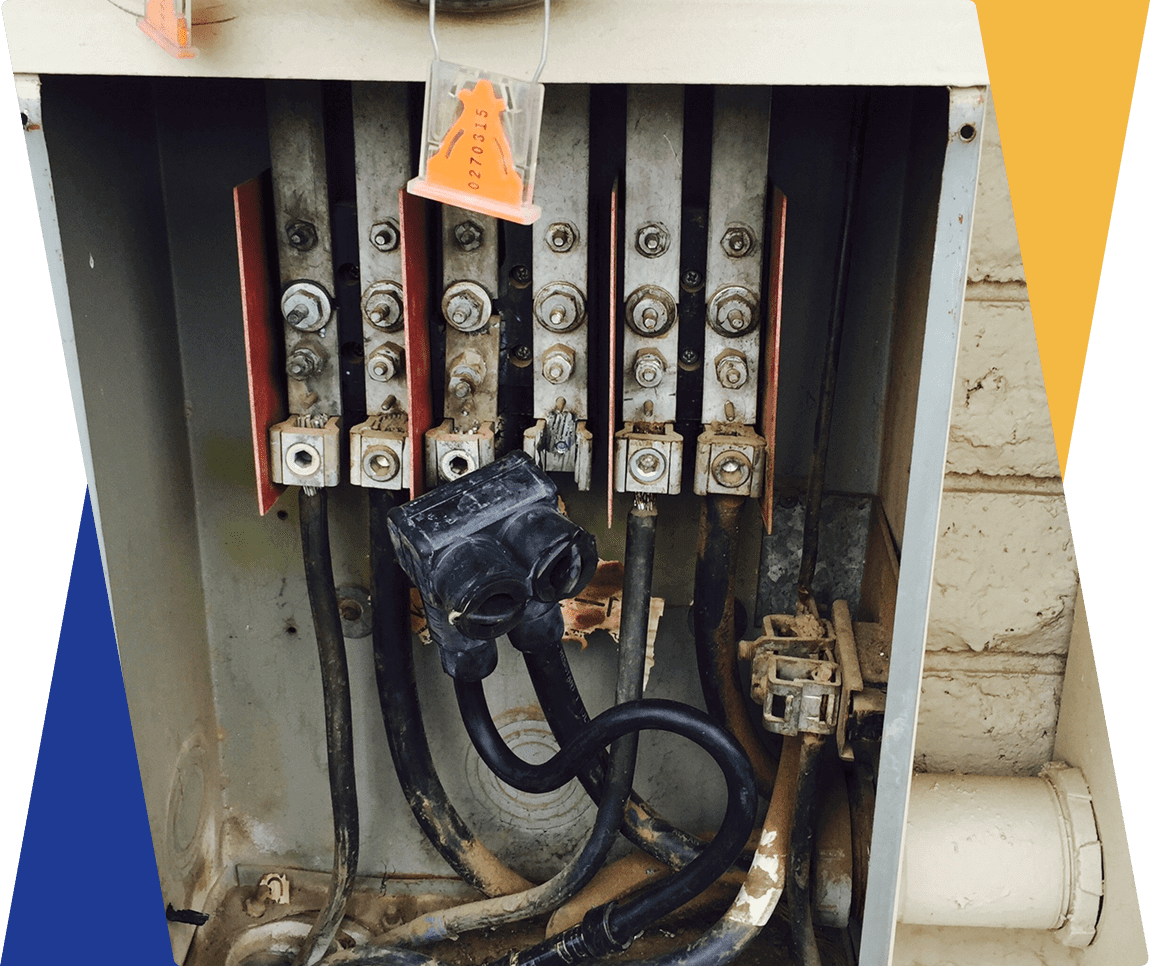 Electrical panel with exposed wires and connectors.