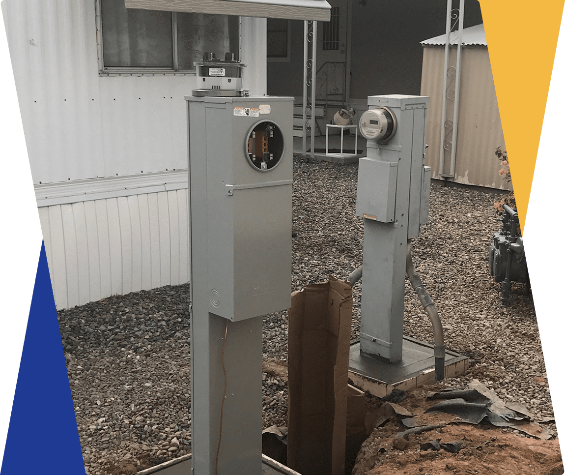 Two electrical meter boxes outside a building.