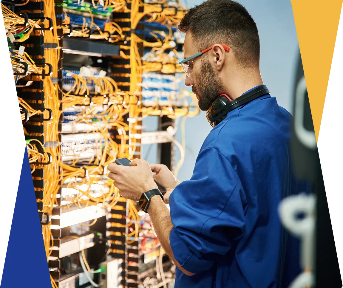 Technician working on a network server rack.